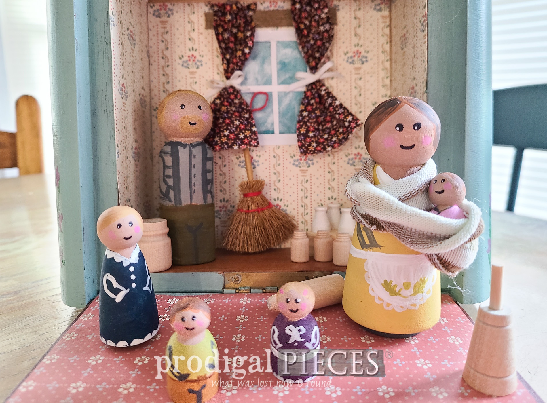 Featured Upcycled Cigar Box Turned Dollhouse by Larissa of Prodigal Pieces | prodigalpieces.com #prodigalpieces #upcycled #toys #kids #dolls #travel #giftidea